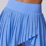 Light blue pleated custom tennis skirt with asymmetrical hem