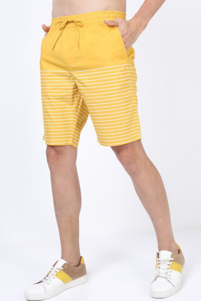 Close-up of fabric on men's yellow striped casual shorts from custom shorts manufacturer