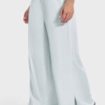 Pale blue drape wide-leg pants with a side split, shown from the back.