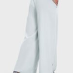 Pale blue drape wide-leg pants featuring a side split, shown from the side.