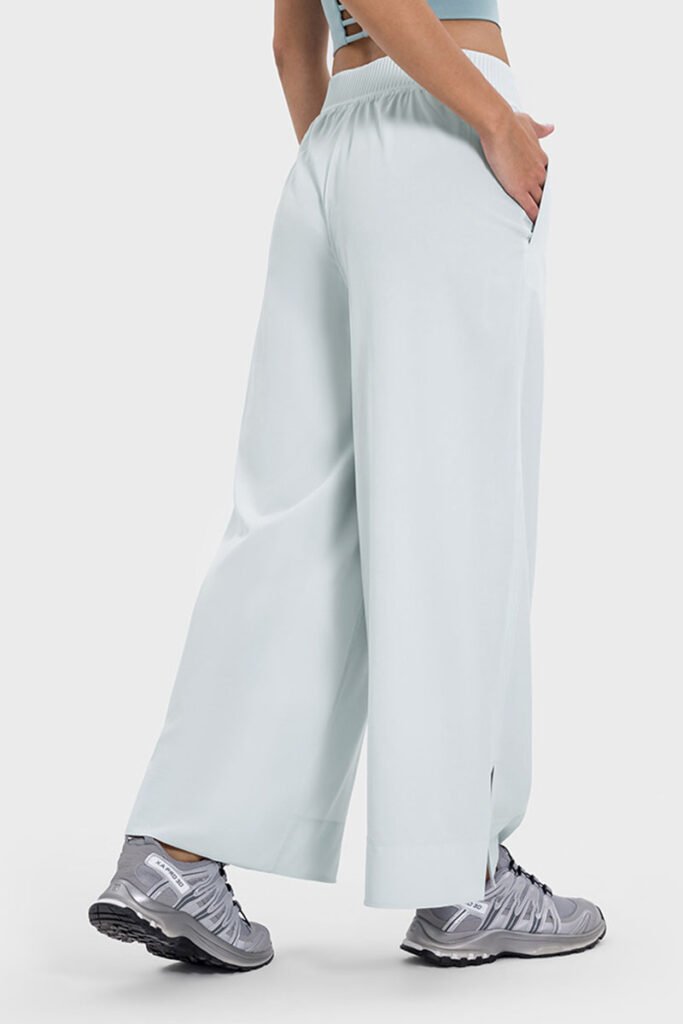 Pale blue drape wide-leg pants featuring a side split, shown from the side.