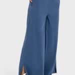 Blue drape wide-leg pants with a side split, shown in a side view.