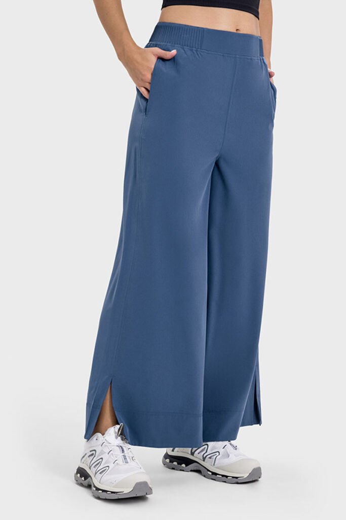 Blue drape wide-leg pants with a side split, shown in a side view.