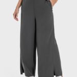 Dark gray drape wide-leg pants with a side split, shown from the side.