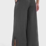 Dark gray drape wide-leg pants with a side split, shown from the back.