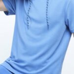 Model wearing men's hooded t-shirt, perfect for sports and casual wear - Yuanyi Apparel