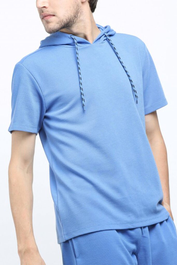 Model wearing men's hooded t-shirt, perfect for sports and casual wear - Yuanyi Apparel