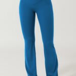 Blue flare yoga pants cross waistband design, ideal for gym and yoga sessions.